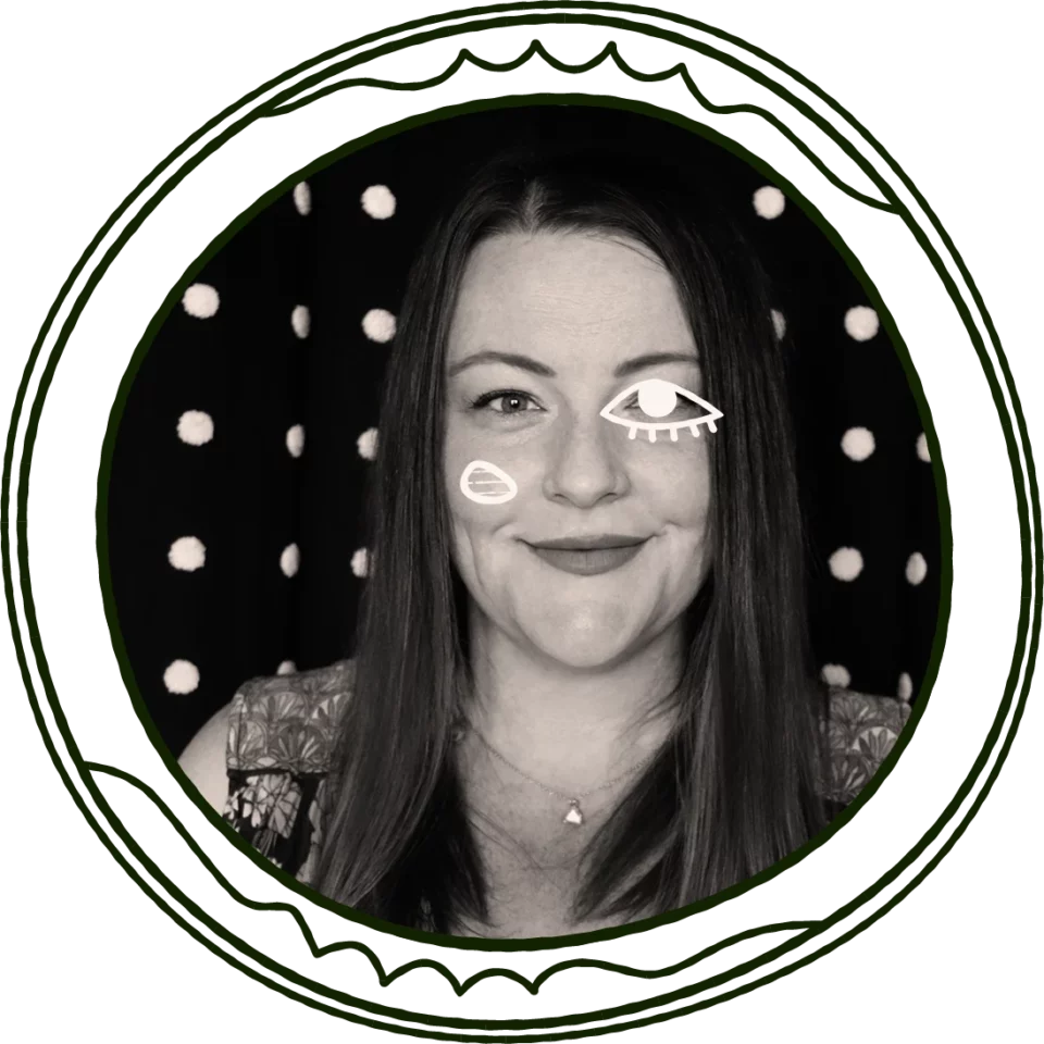 black and white photo of graphic designer, brand identity designer, web designer, illustrator and moonface co-founder, lauren, in a dark green line illustration of an a circular ornate frame. woman in mid-30s wears retro patterned jumpsuit. animated images of large eye and a rosy cheek flash on her face, both elements taken from the moonface design co. original logo.