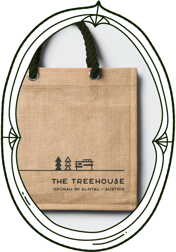 tote bag printed with a minimalist, modern logo featuring a treehouse icon and two trees for the treehouse traveller lodge.